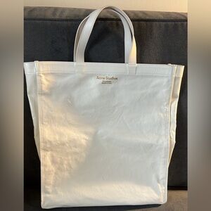 Authentic white unique and trendy Acne studio carry bag.